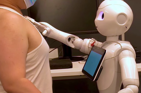 A Robot That Measures Blood Pressure