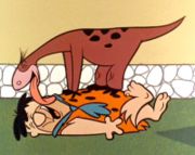cartoon of Dino licking Fred Flintstone